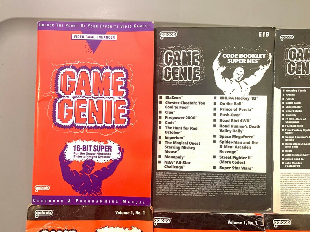 GAME GENIE VIDEO GAME ENHANCER - LOT OF MANUALS AND UPDATES SNES SUPER NINTENDO